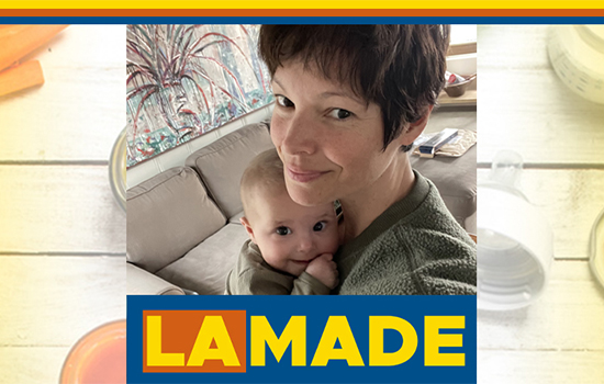 Vane Millon Kuhn holding her baby bordered by LA Made logo.